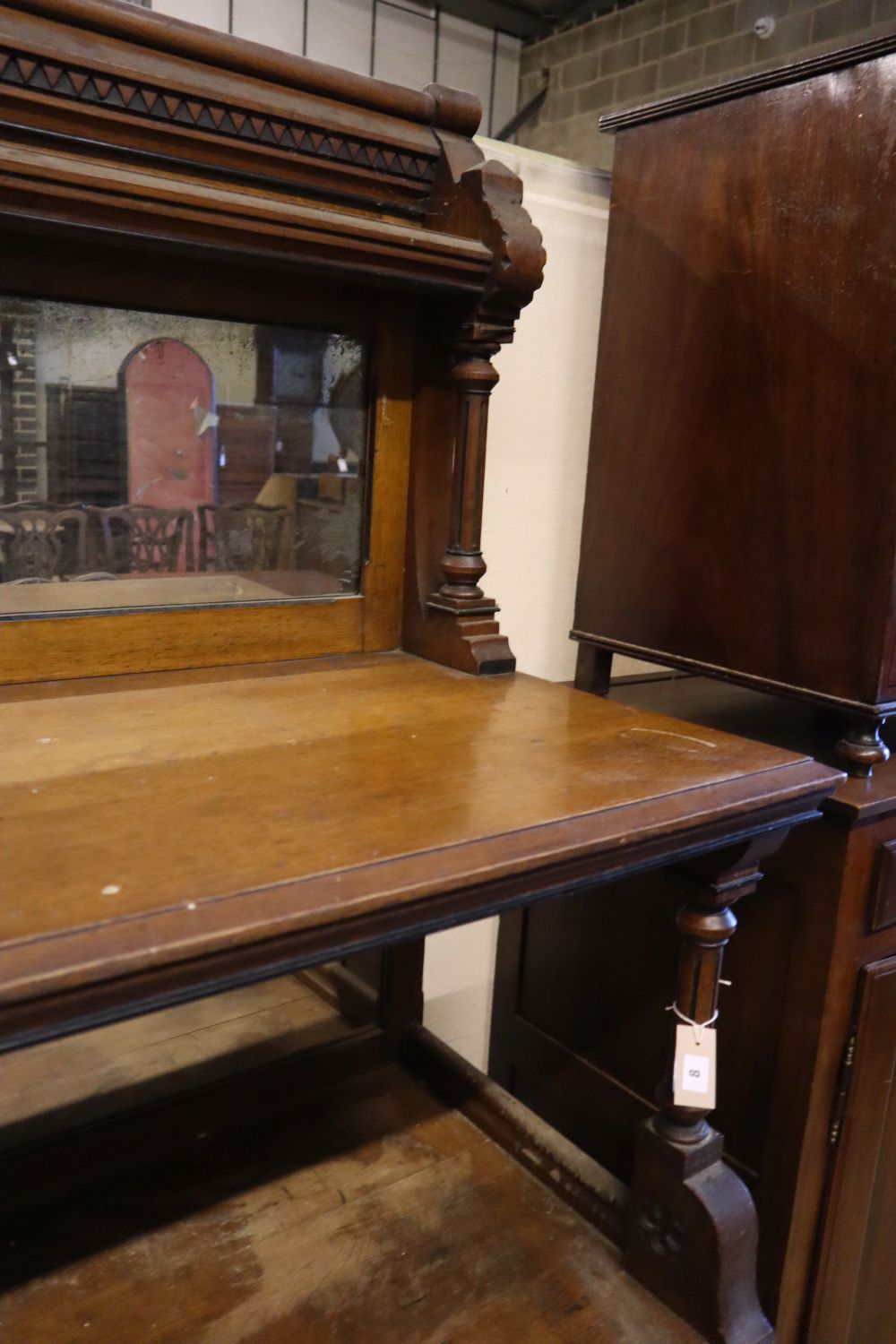 A large late Victorian oak aesthetic movement buffet sideboard, width 183cm depth 58cm height 180cm